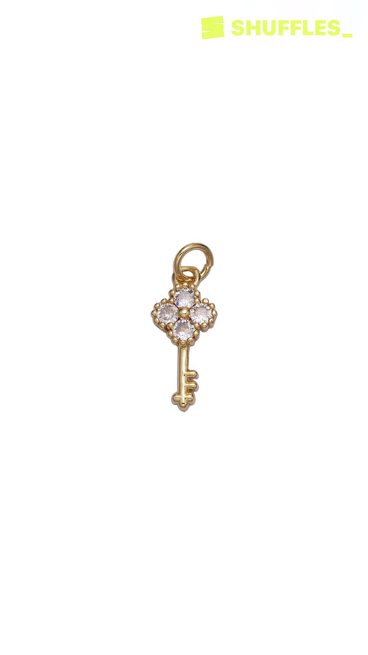 Gold key charm